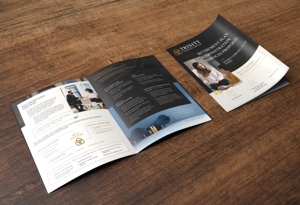 Trinity Plan Administration Brochure laid out on a wooden table